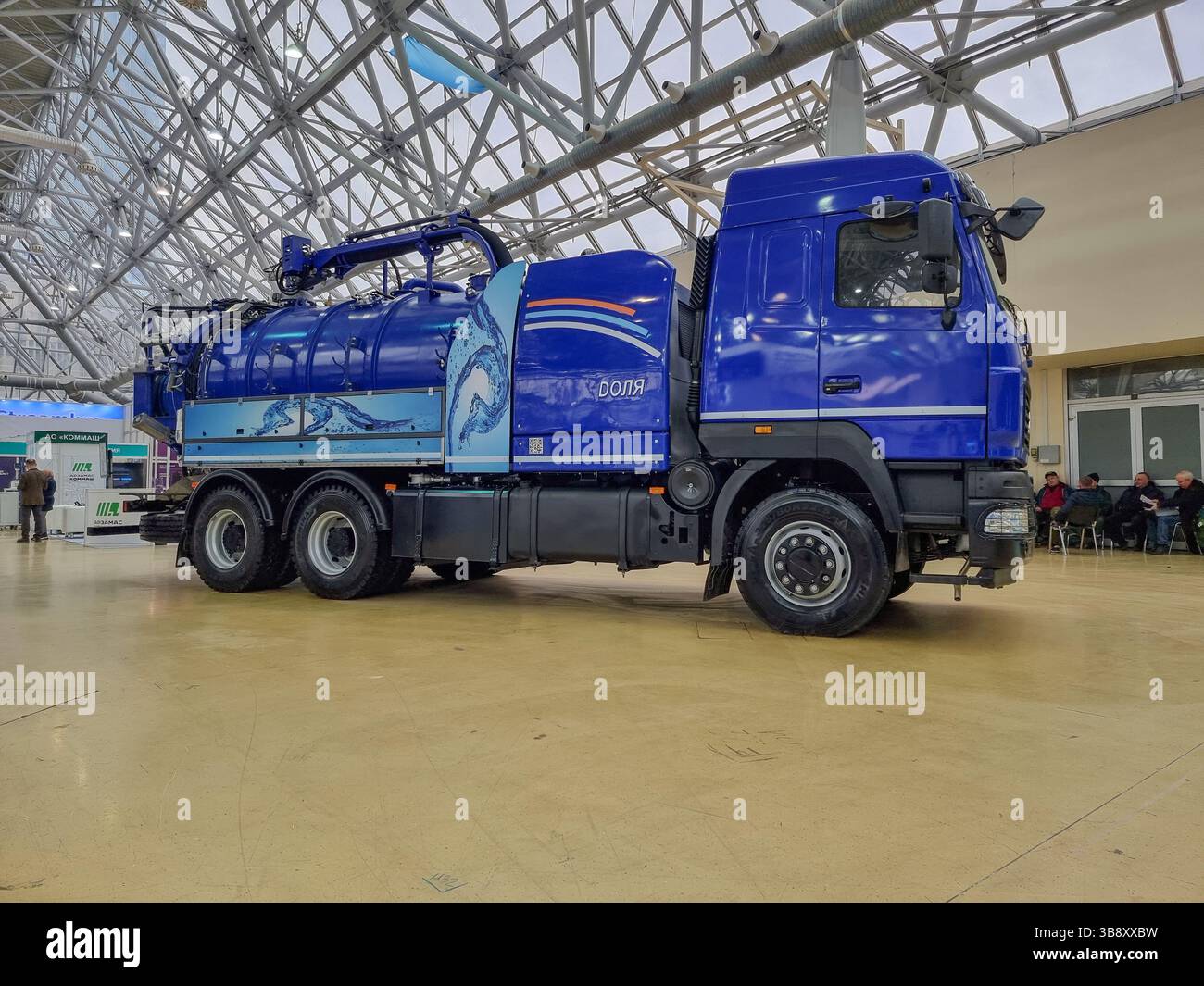 New blue Kamaz truck (vacuum truck) with tank, for water treatment and handling on the expo of the Water Congress Vodexpo in Moscow, Russia - Smartphone Captured Stock Image