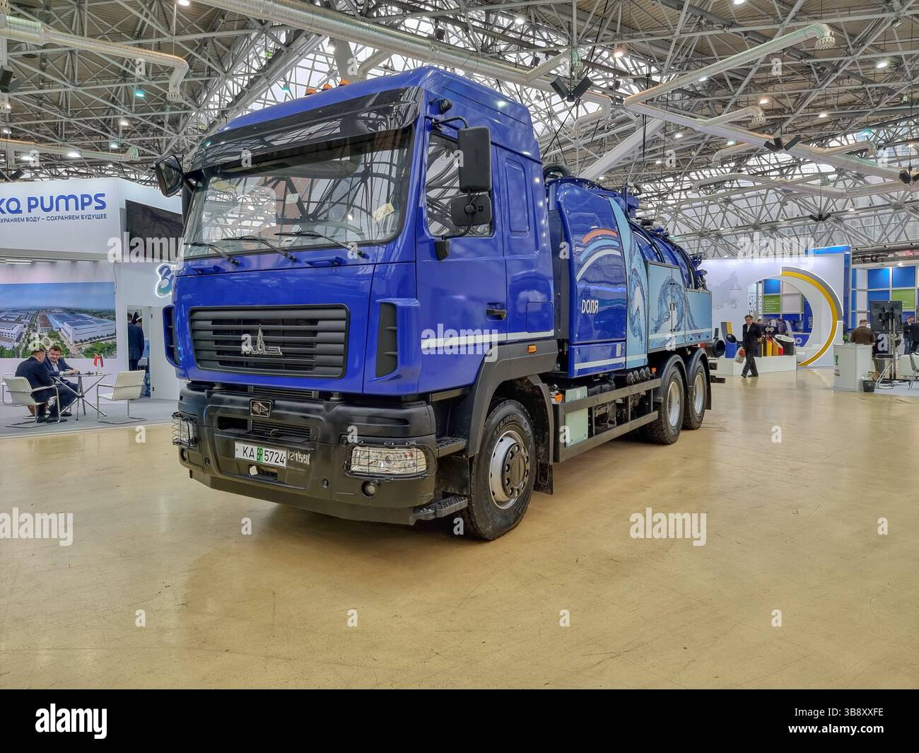 New blue Kamaz truck (vacuum truck) with tank, for water treatment and handling on the expo of the Water Congress Vodexpo in Moscow, Russia - Smartphone Captured Stock Image