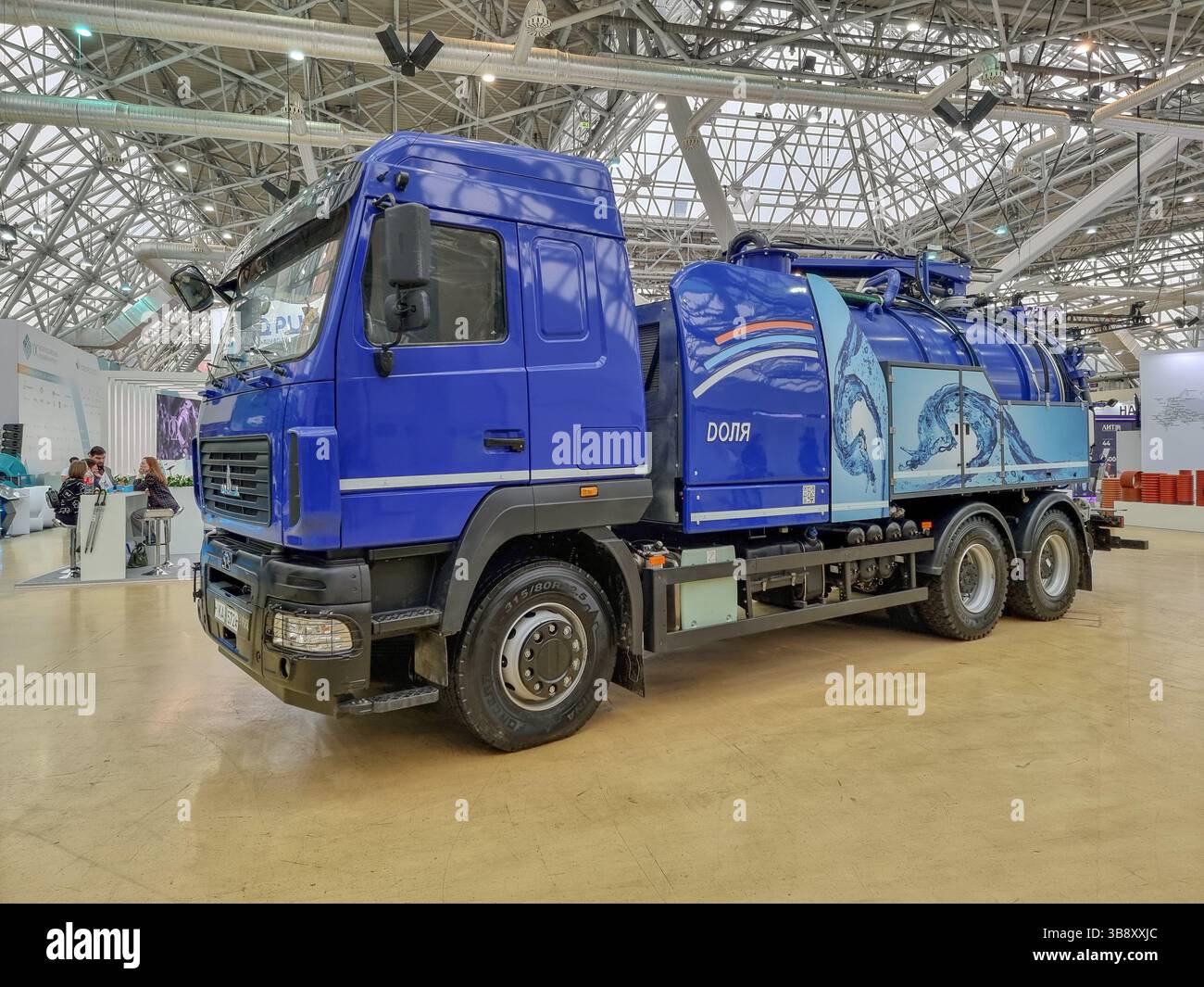 New blue Kamaz truck (vacuum truck) with tank, for water treatment and handling on the expo of the Water Congress Vodexpo in Moscow, Russia - Smartphone Captured Stock Image