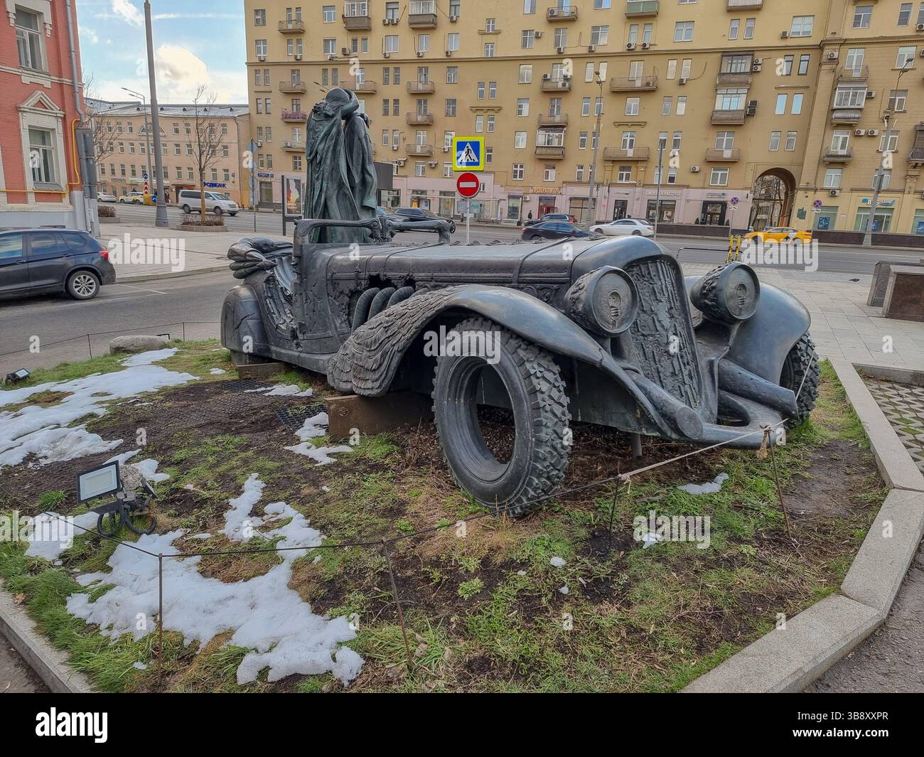 Bronze monument to Mikhail Bulgakov & the heroes of his book The Master and Margarita by Alexander Rukavishnikov in Moscow; bird behind steering wheel - Smartphone Captured Stock Image