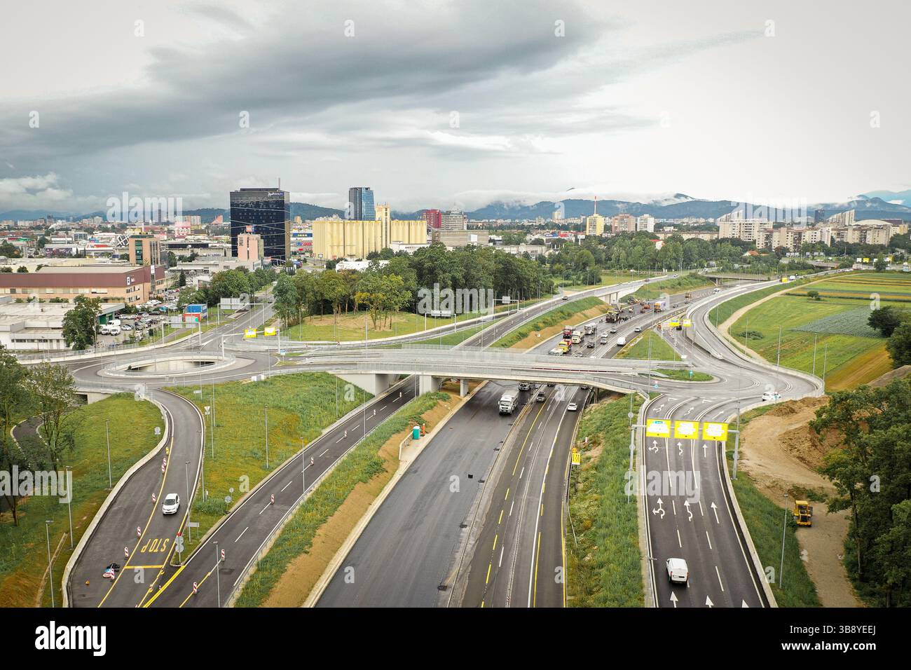 Newly created highway, overpass, roundabout, and highway ramps, aerial ...