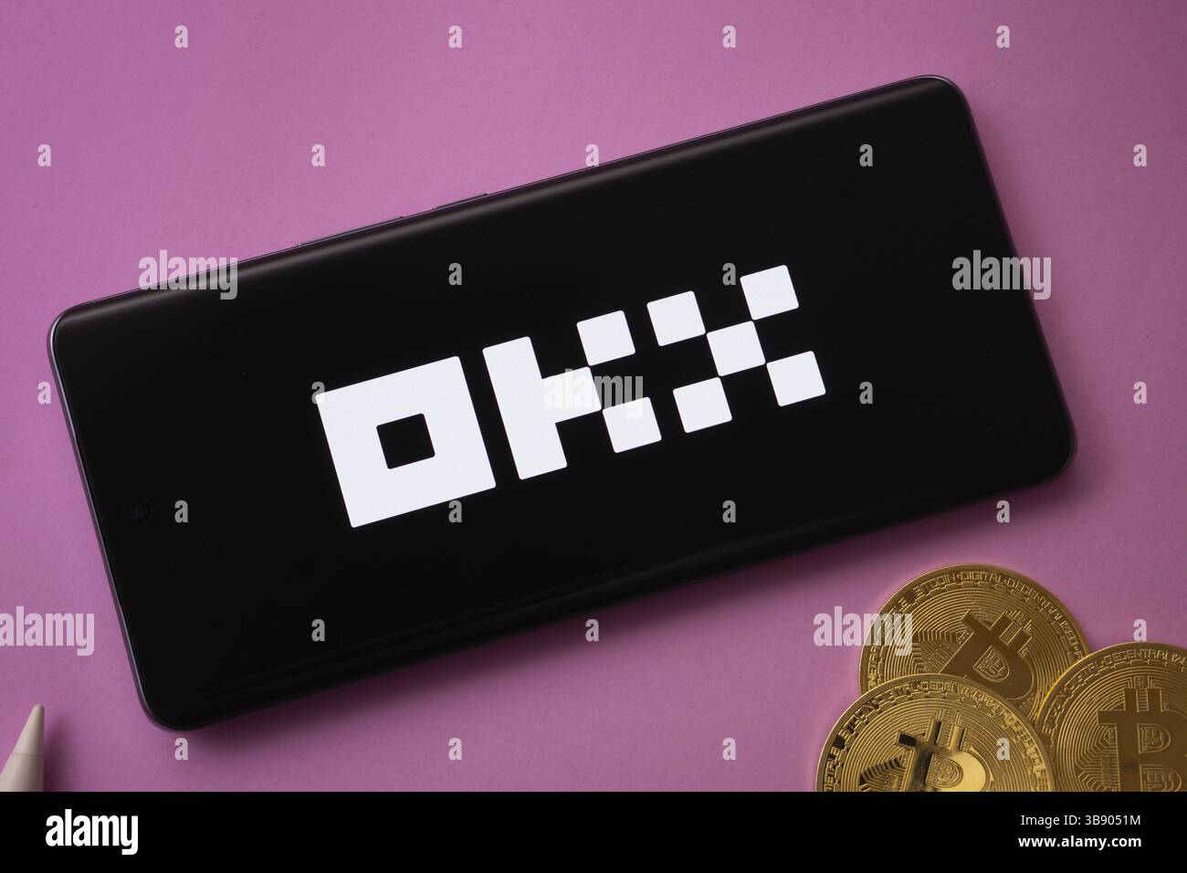 Dhaka, Bangladesh - 04 April 2025: The logo of the OKX is displayed on a smartphone screen. OKX is the second largest cryptocurrency exchange platform Stock Photo
