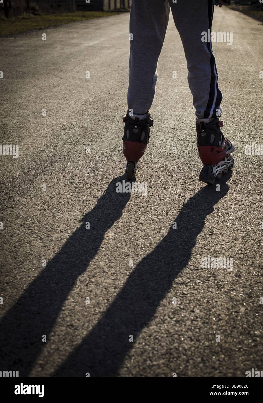 Roller skating on the road, close up legs Stock Photo