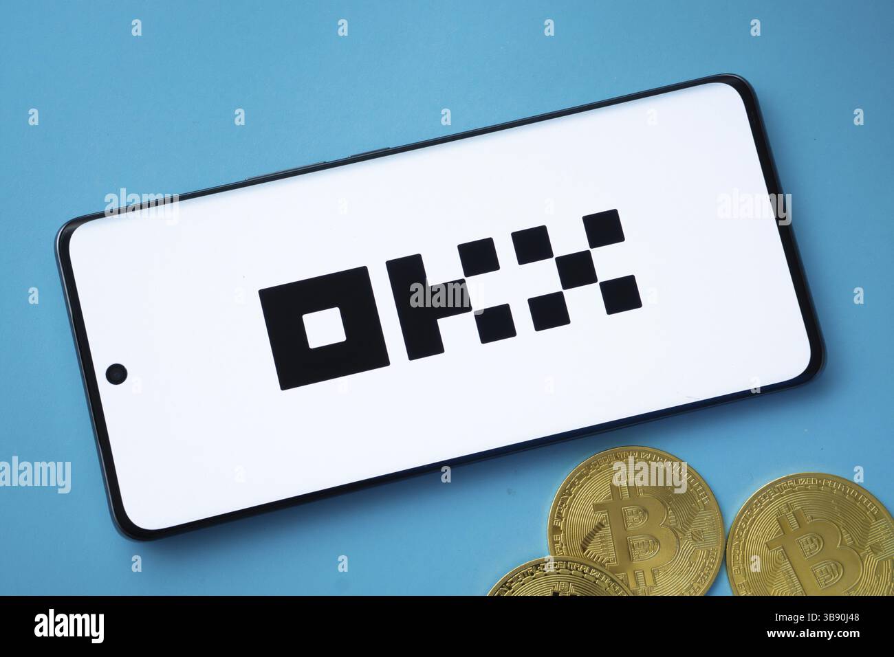Dhaka, Bangladesh - 04 April 2025: The logo of the OKX is displayed on a smartphone screen. OKX is the second largest cryptocurrency exchange platform Stock Photo