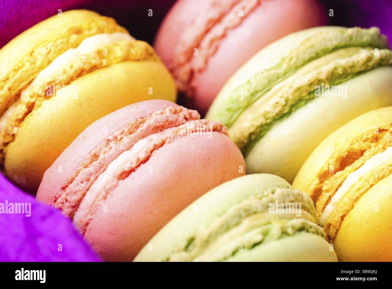 Macaroons in row close up in box Stock Photo