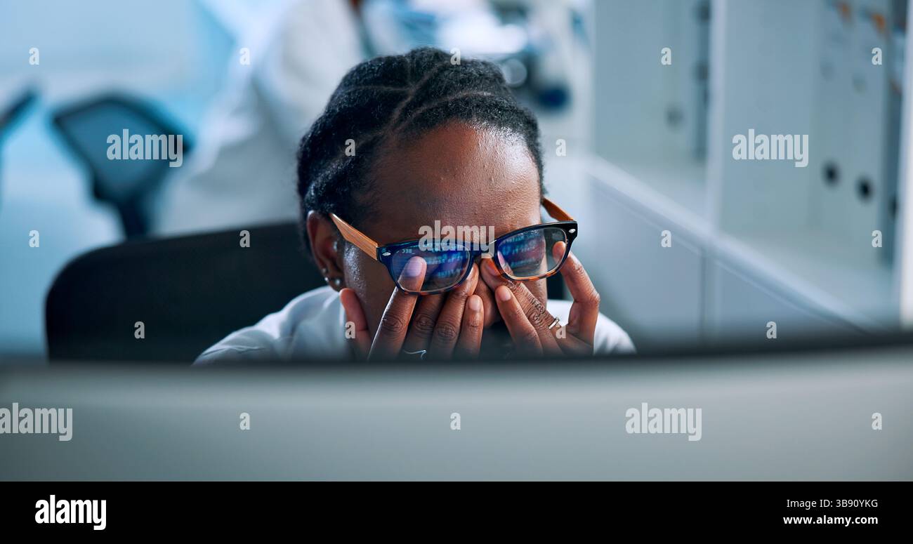 Tired, programmer and glasses with woman and computer for algorithm glitch, code error or eye strain. Cyber security breach, burnout and vision Stock Photo