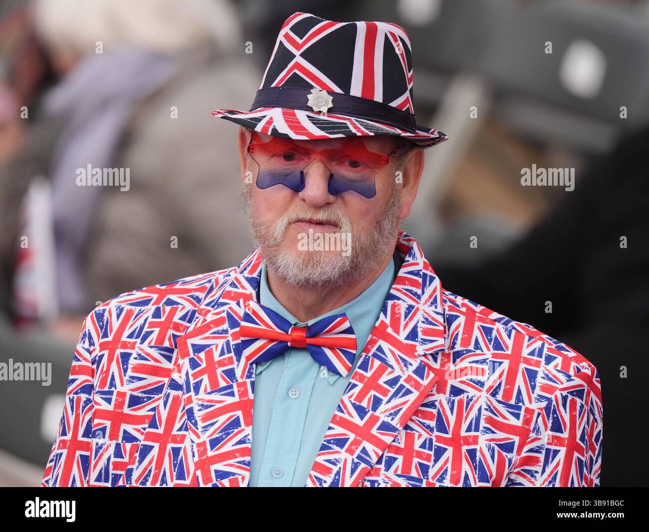 Members of the audience wearing patriotic outfits before the start of the concert celebrating the 80th Anniversary of VE Day, held at the historic Horse Guards Parade in central London. Picture date: Thursday May 8, 2025. Stock Photo