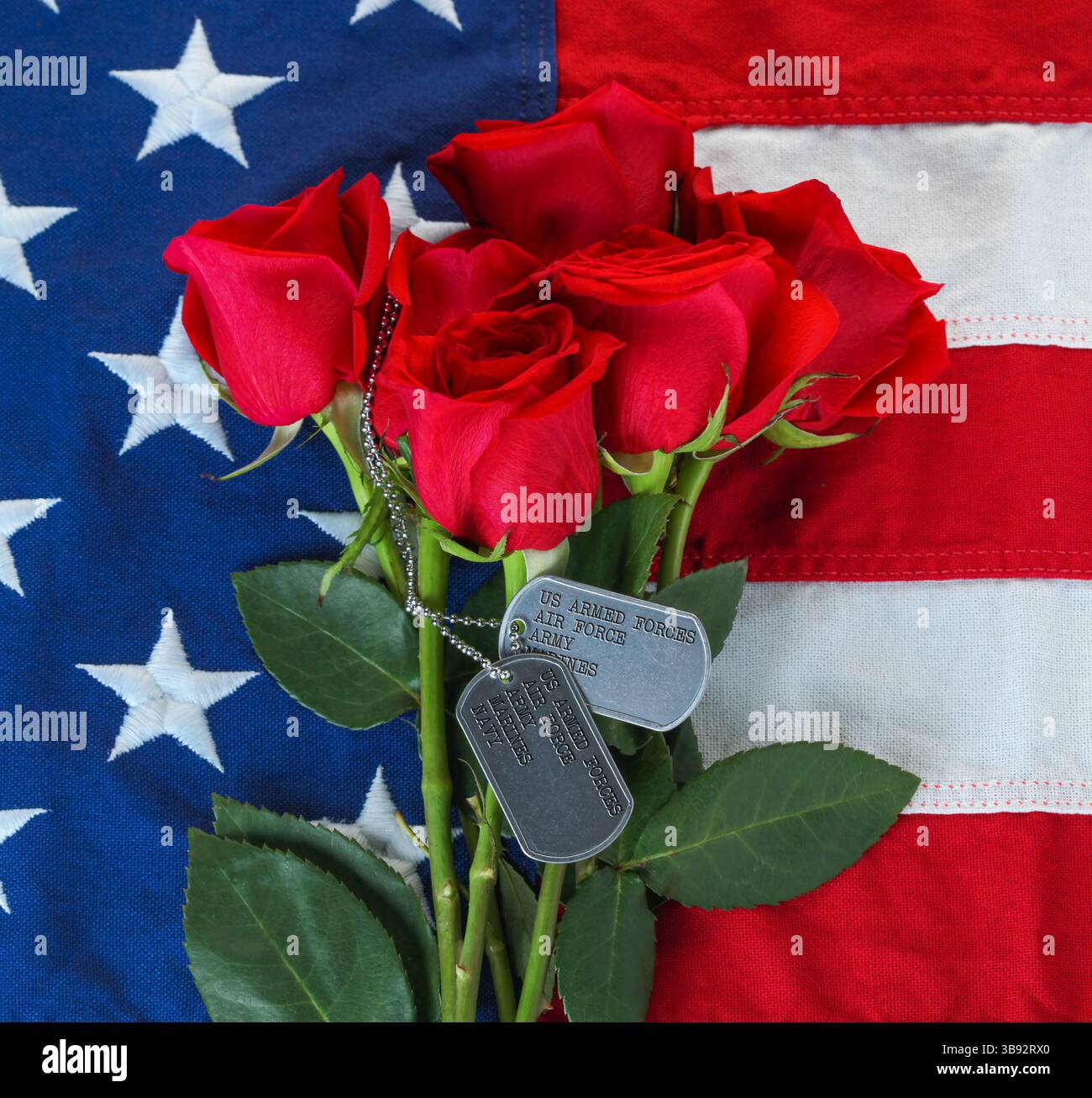 American flag with roses and military dog tags with text listing ...