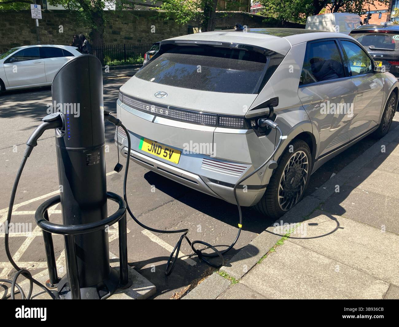 Hyundai IONIQ 9 Electric vehicle EV Car charging point on street - Smartphone Captured Stock Image