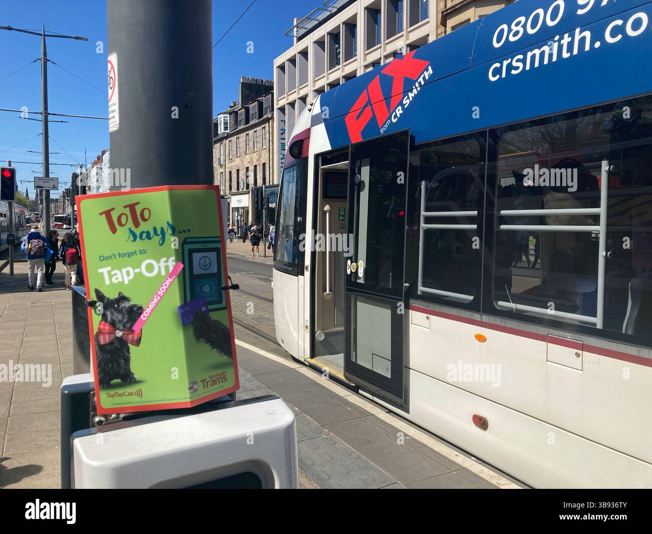 Publicity on the tram platform for the Tap on Tap Off system being implemented on Edinburgh Trams from the 19th May, Princes Street Edinburgh Scotland - Smartphone Captured Stock Image