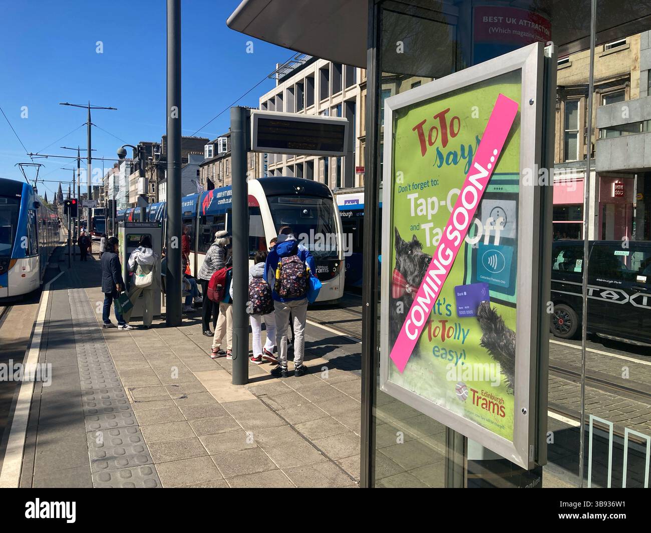 Publicity on the tram platform for the Tap on Tap Off system being implemented on Edinburgh Trams from the 19th May, Princes Street Edinburgh Scotland - Smartphone Captured Stock Image