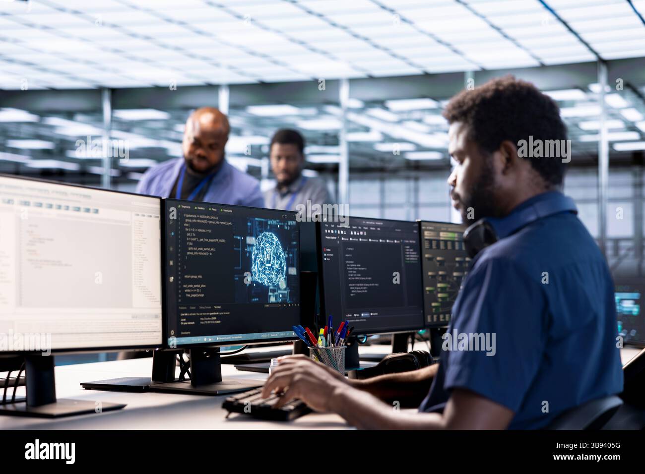Server farm IT specialist using AI systems to input data faster during complex computational tasks. Software developer in data center using artificial intelligence parallel processing tech Stock Photo