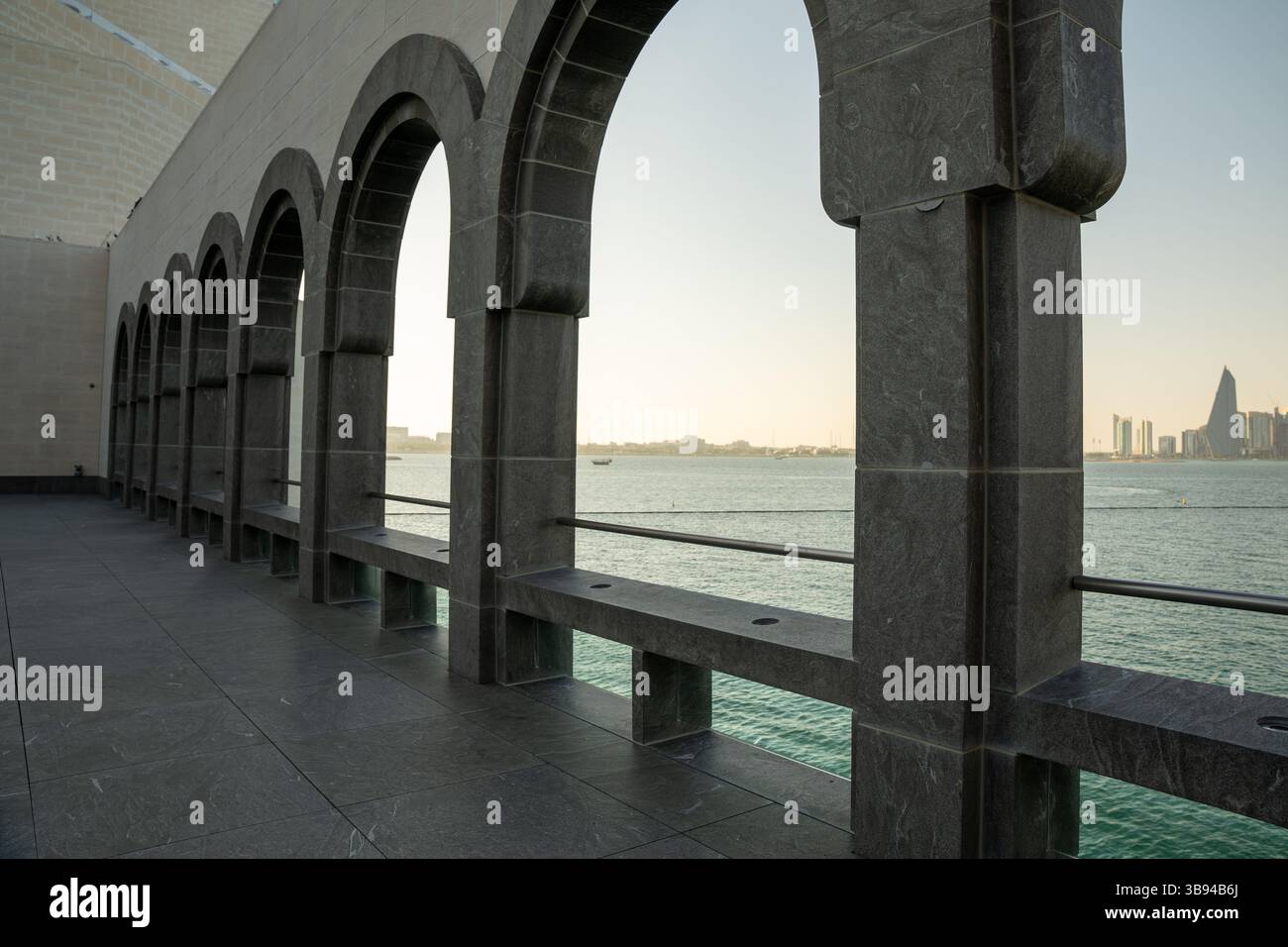 Arches overlooking the city Doha, Qatar. Breathtaking views of the Doha skyline and the Persian Gulf. Stock Photo