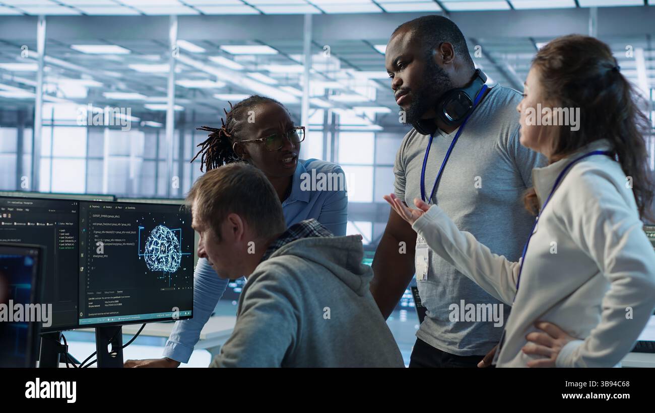 Engineer calling colleagues after finding error in code while doing checkup on server room used for AI workloads. Man requesting help from coworkers after finding bug in data center systems, camera A Stock Photo