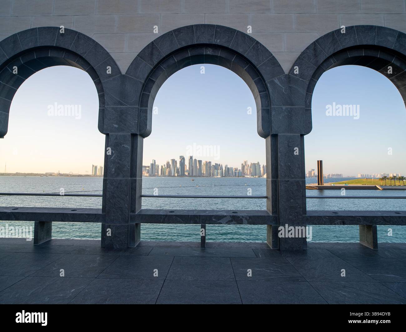 Arches overlooking the city Doha, Qatar. Breathtaking views of the Doha skyline and the Persian Gulf. Stock Photo
