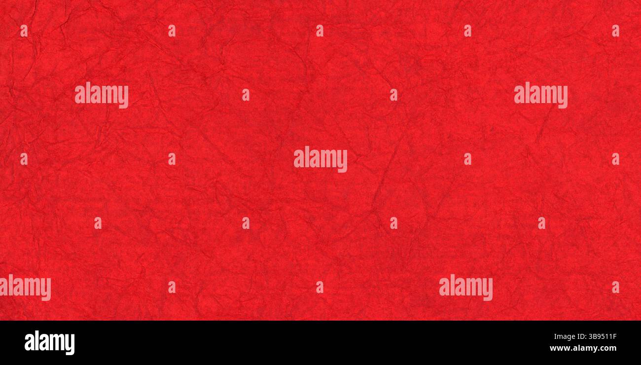 Textured red paper with rough wrinkled lines. Crumpled red paper background. Stock Photo