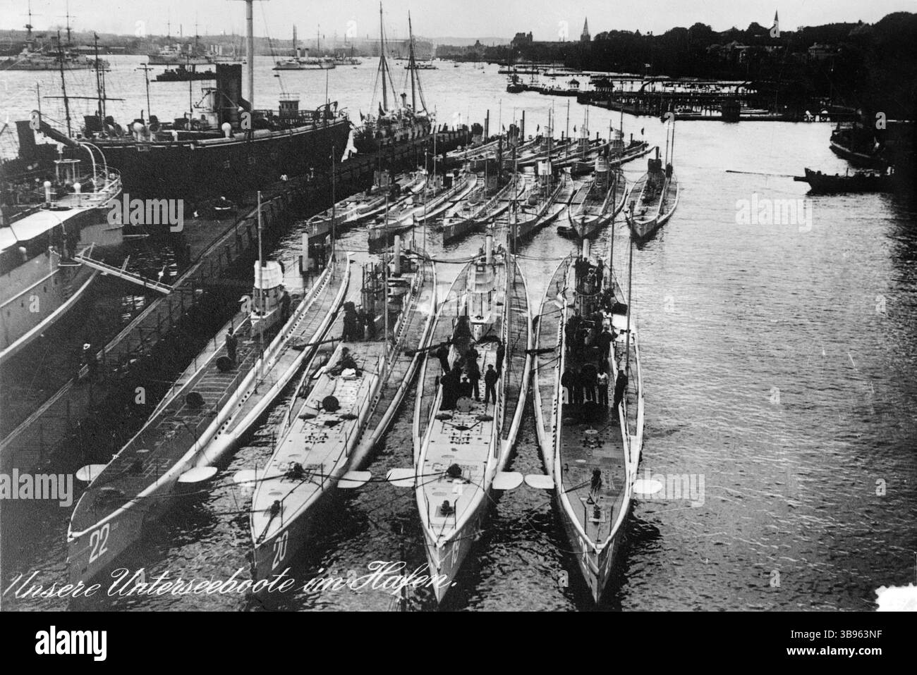 The German pre-war submarine fleet at harbour in Kiel. U-20, which sank the Lusitania,  is second from left. Lusitania was a British-registered ocean liner that was torpedoed by a U-boat during the First World War on 7 May 1915, off the Old Head of Kinsale, Ireland. Aboard her were 1,264 passengers, 3 stowaways and a crew of 693, totalling 1,960 people, of which 1,197 were killed. The ship sank in only 18 minutes. The sinking turned public opinion away from Germany and the death of 128 Americans aboard was a big factor in the USA entry into the war. Stock Photo