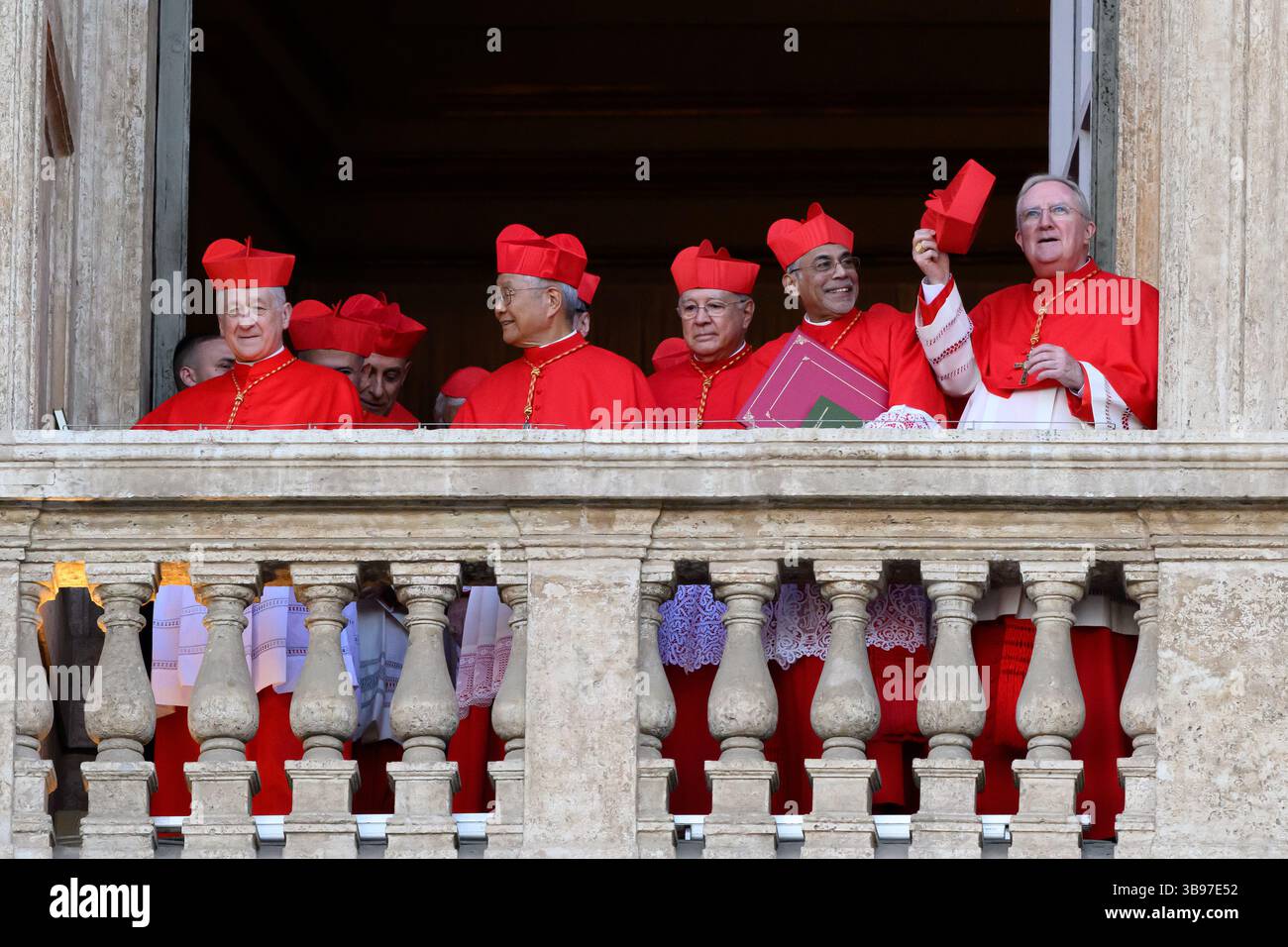 Vatican City, Italy. 08th May, 2025. Cardinals stand on a balcony of St. Peter's Basilica while the newly elected Pope Leo XIV, the American Robert Prevost, speaks in Vatican city on May 8, 2025. Credit: Insidefoto/Alamy Live News Stock Photo