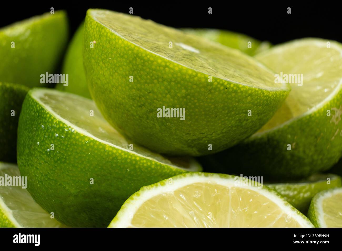 Sliced Open Limes in Close Focus Stock Photo