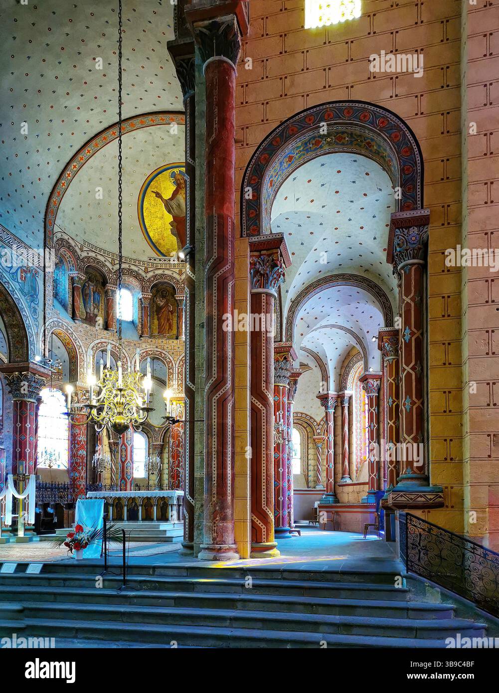 Issoire, colourful columns of the Roman abbatial, Abbey of Saint-Austremoine, Puy de Dome department, Auvergne Rhone Alpes, France, Europe - Smartphone Captured Stock Image
