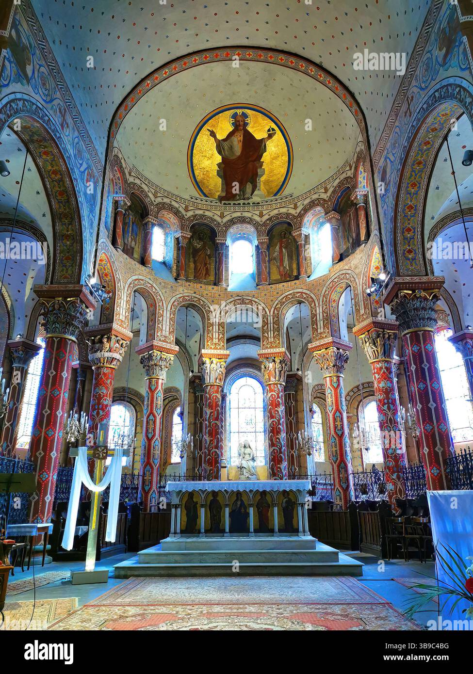 Issoire, colourful columns of the Roman abbatial, Abbey of Saint-Austremoine, Puy de Dome department, Auvergne Rhone Alpes, France, Europe - Smartphone Captured Stock Image