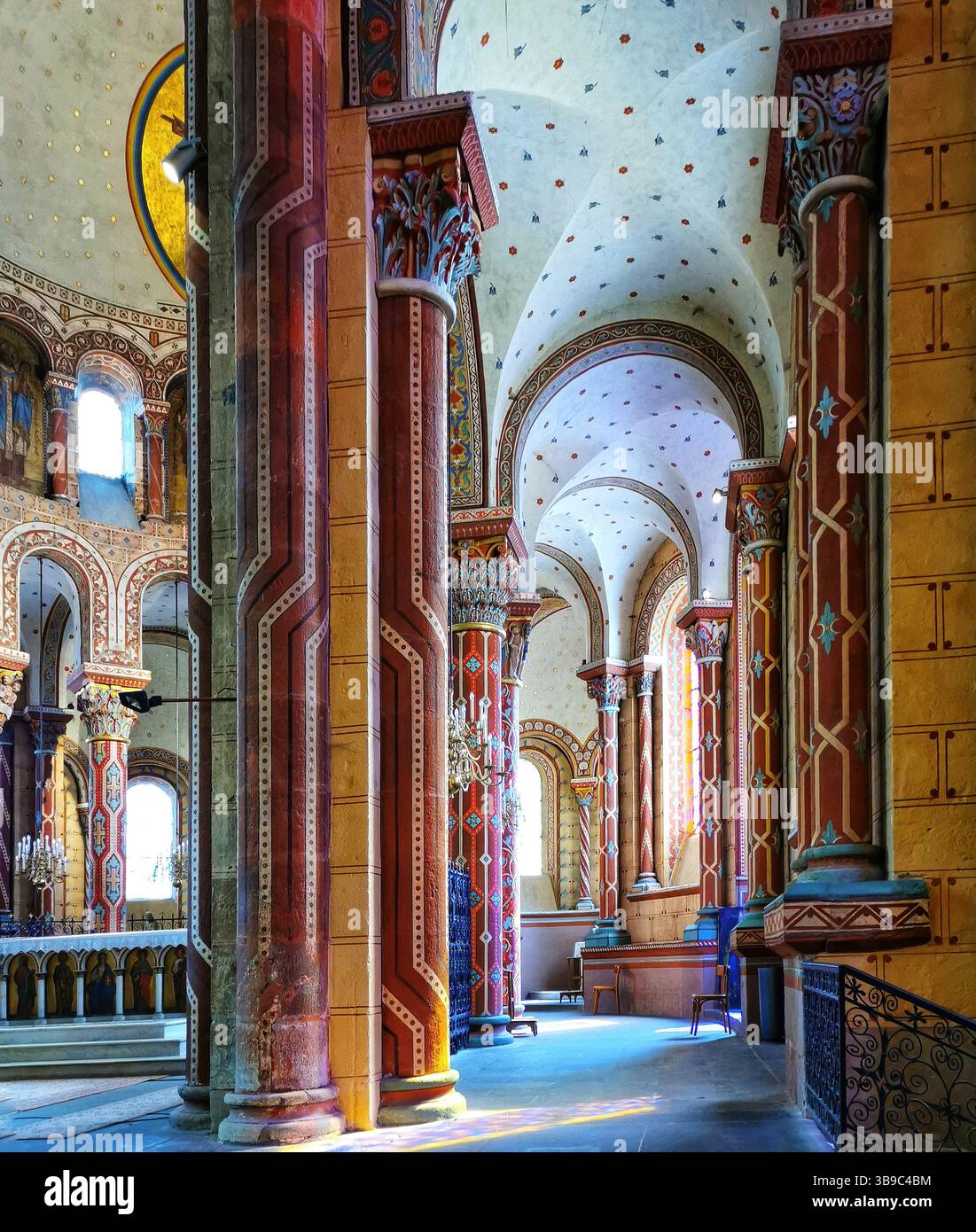 Issoire, colourful columns of the Roman abbatial, Abbey of Saint-Austremoine, Puy de Dome department, Auvergne Rhone Alpes, France, Europe - Smartphone Captured Stock Image