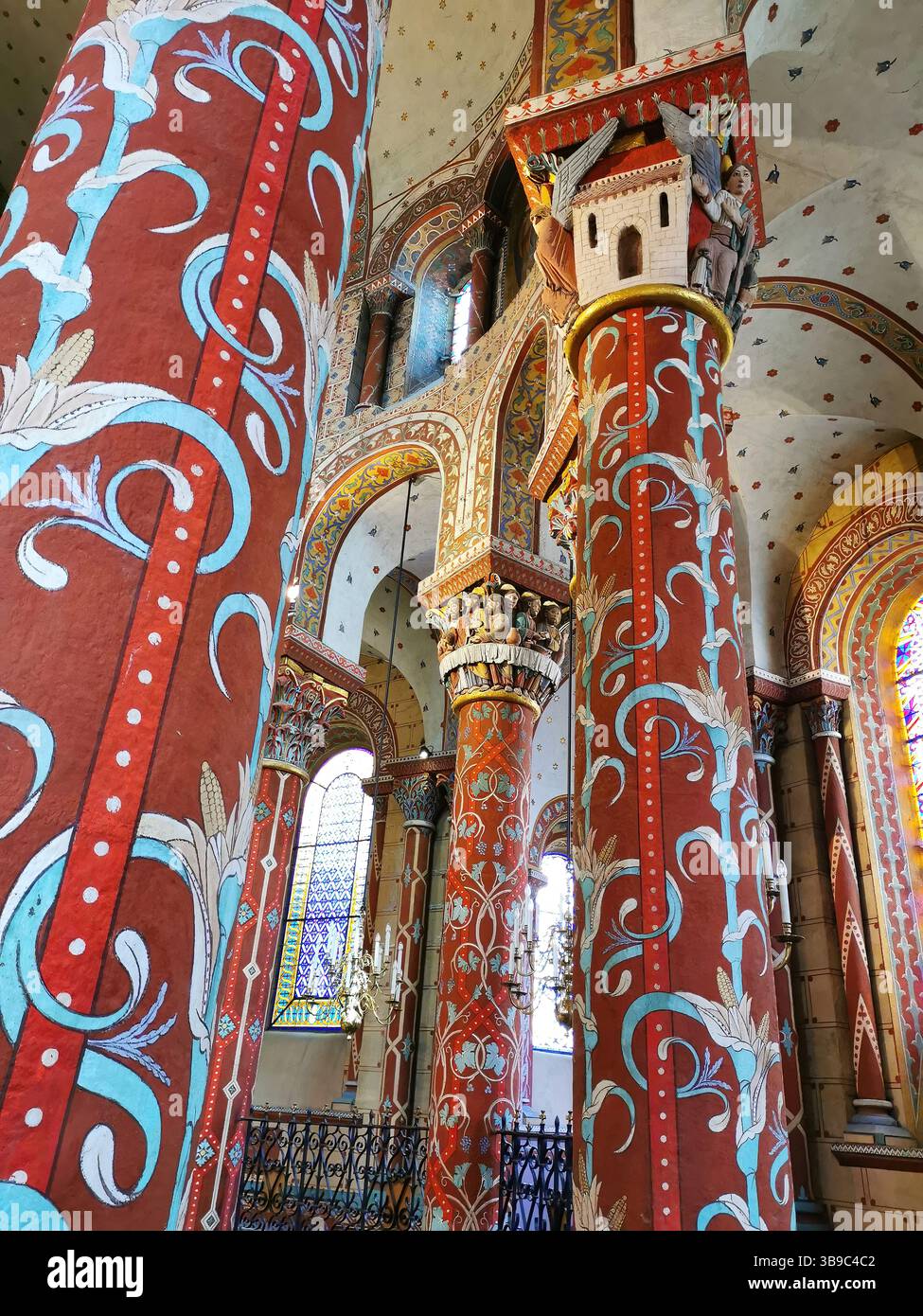 Issoire, colourful columns of the Roman abbatial, Abbey of Saint-Austremoine, Puy de Dome department, Auvergne Rhone Alpes, France, Europe - Smartphone Captured Stock Image