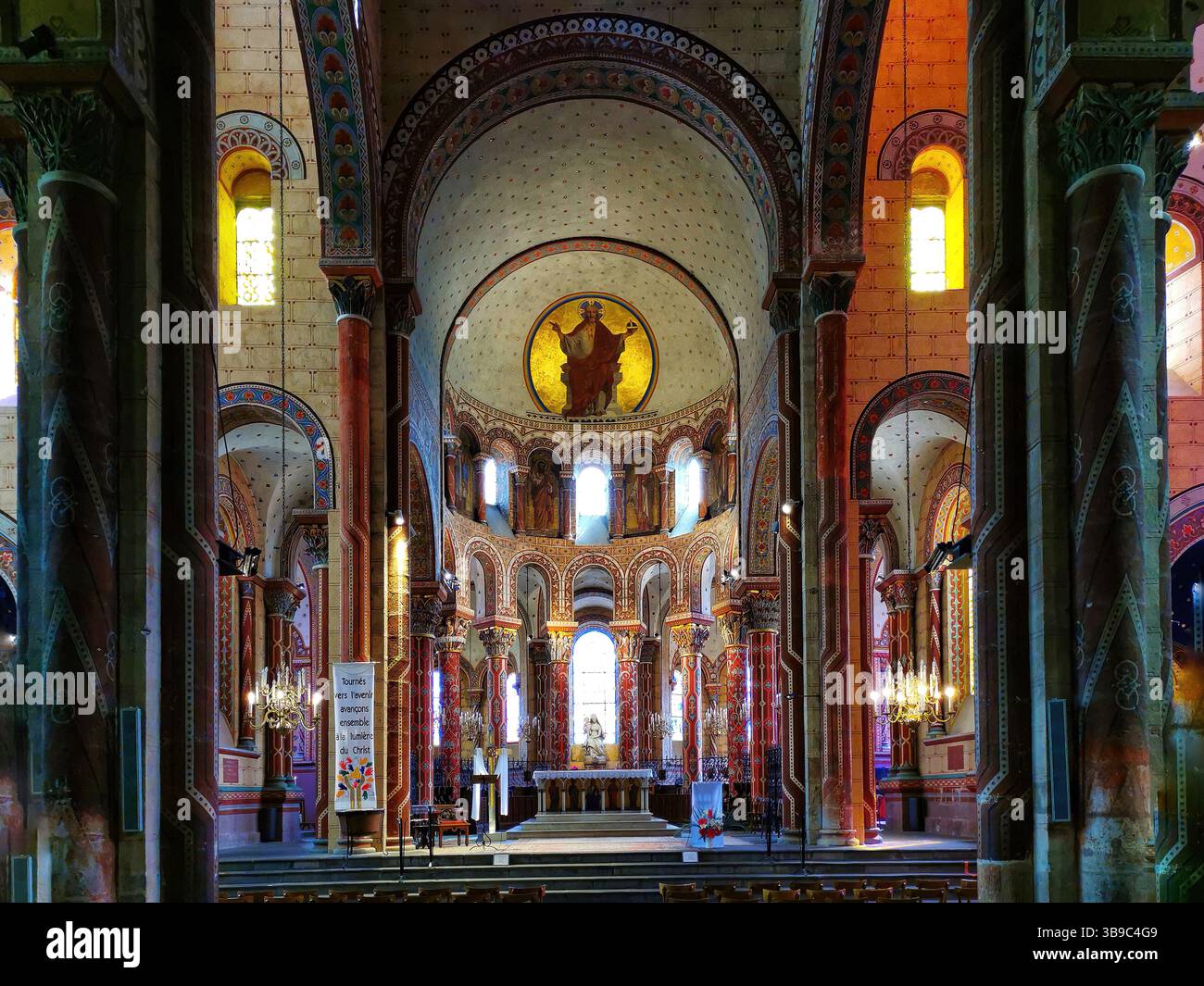 Issoire, colourful columns of the Roman abbatial, Abbey of Saint-Austremoine, Puy de Dome department, Auvergne Rhone Alpes, France, Europe - Smartphone Captured Stock Image