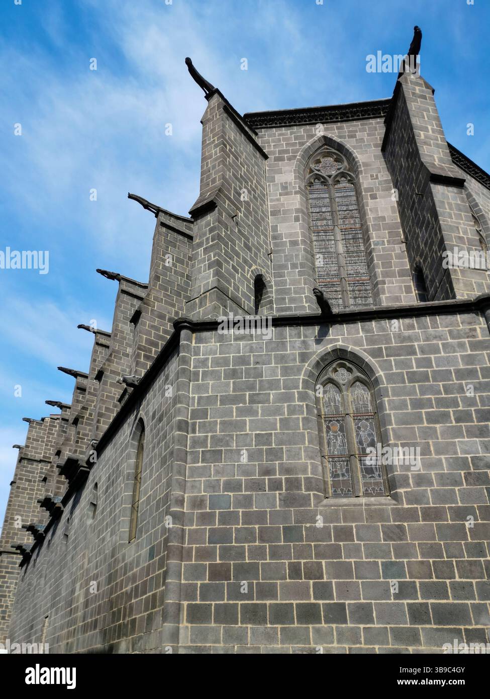 Gargoyles perched on Notre Dame Church overlooking Montferrand in Puy de Dome, Auvergne Rhone Alpes, France - Smartphone Captured Stock Image