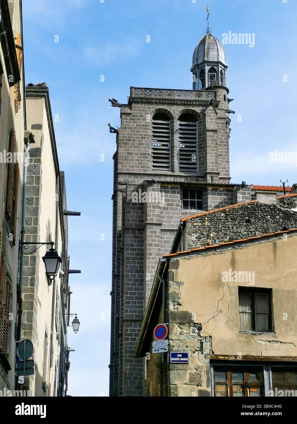 Architecture of  Notre Dame church in Montferrand, Puy de Dome, France showcasing unique stone details and design elements - Smartphone Captured Stock Image