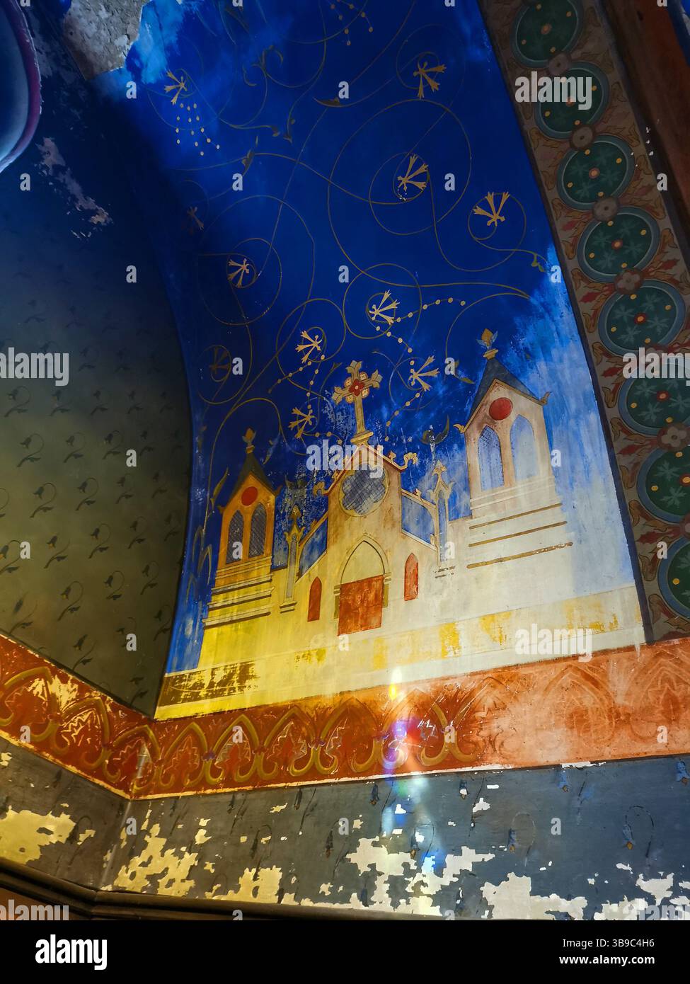 Beautiful painted wall featuring religious motifs in Notre Dame Church, Montferrand, Puy De Dome, Auvergne Rhone Alpes, France - Smartphone Captured Stock Image