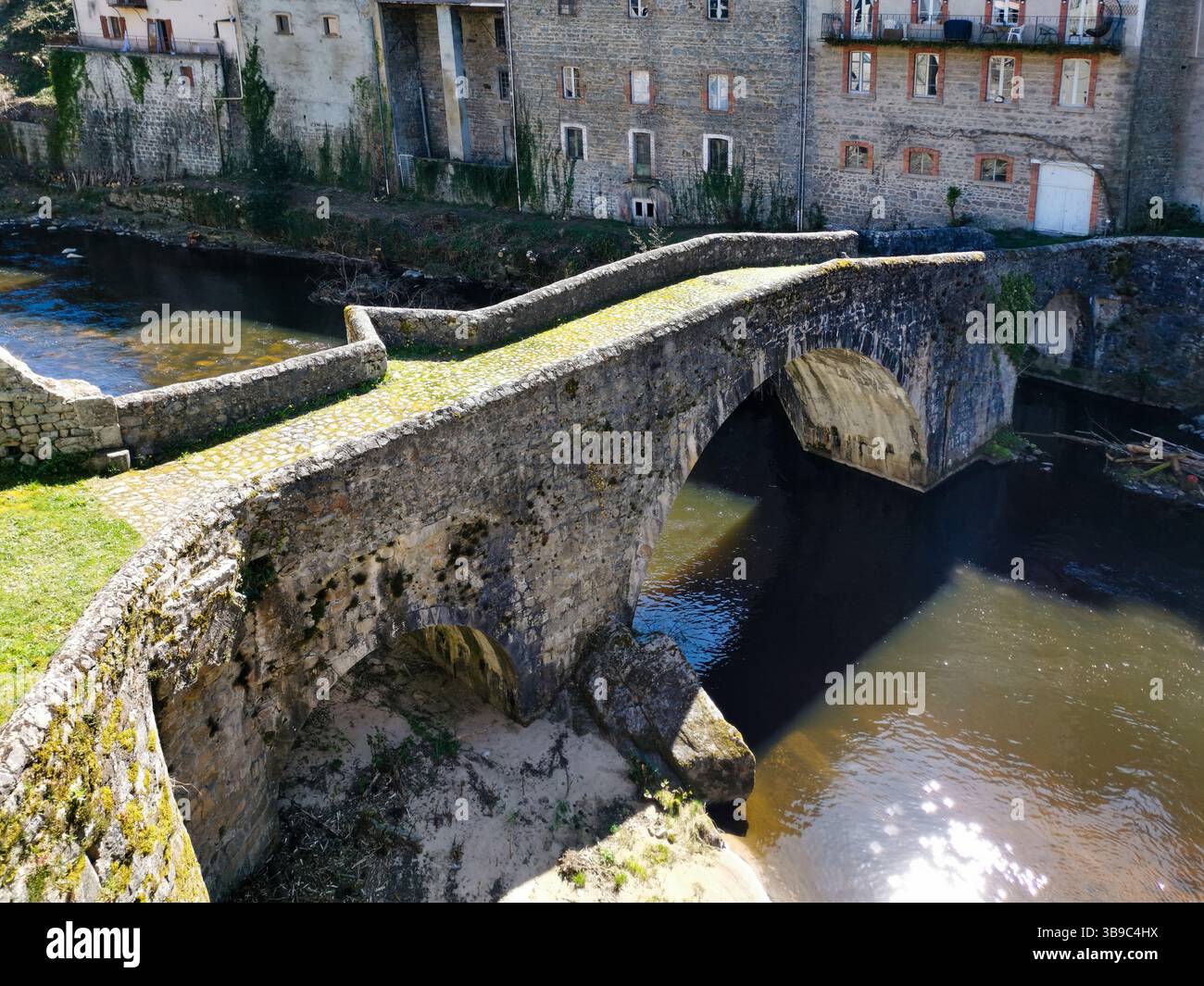 Olliergues. Old bridge on river Dore. Natural regional park of Livradois Forez. Puy de Dome. Auvergne Rhone Alpes. France - Smartphone Captured Stock Image