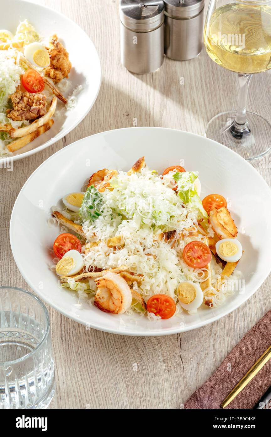 Caesar salad with shrimp and parmesan cheese Stock Photo
