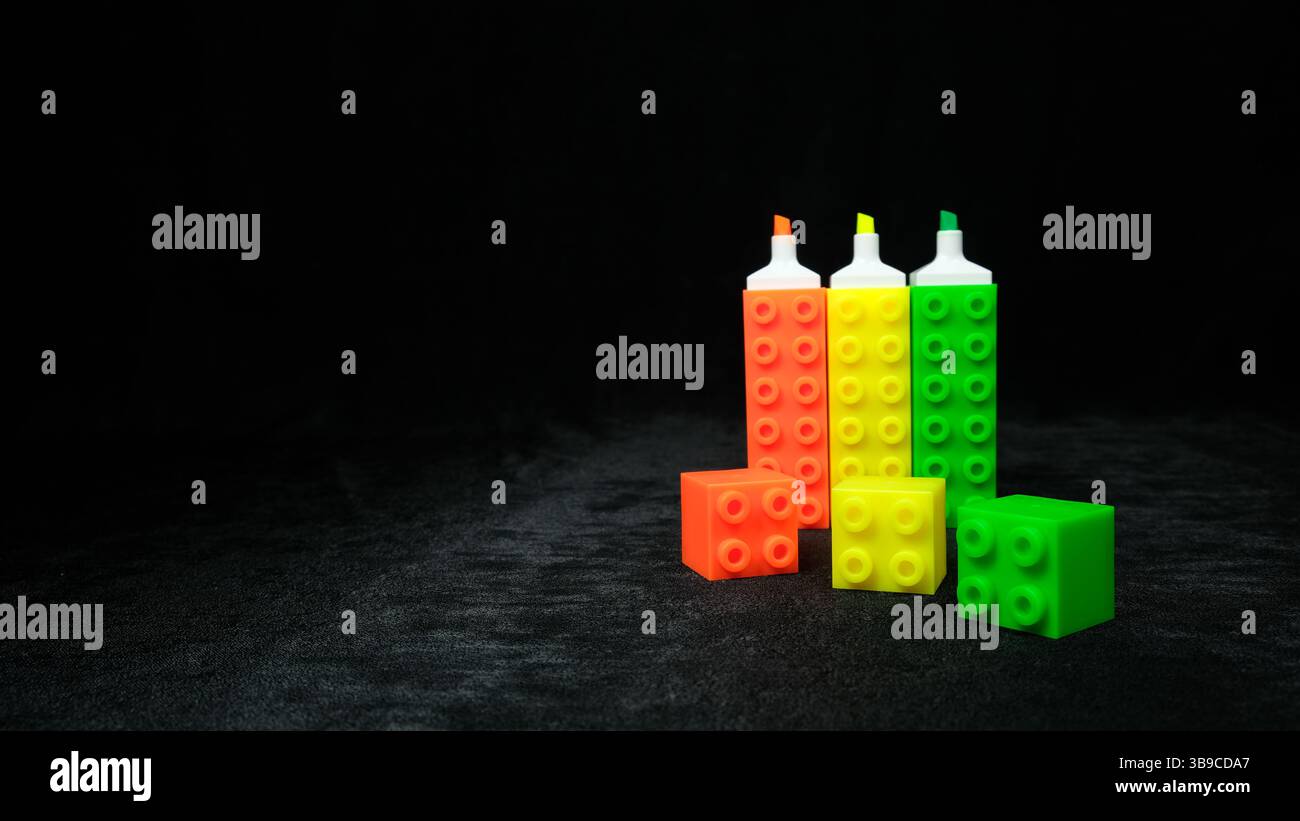 Neon highlighter markers resembling colorful Lego blocks Stock Photo