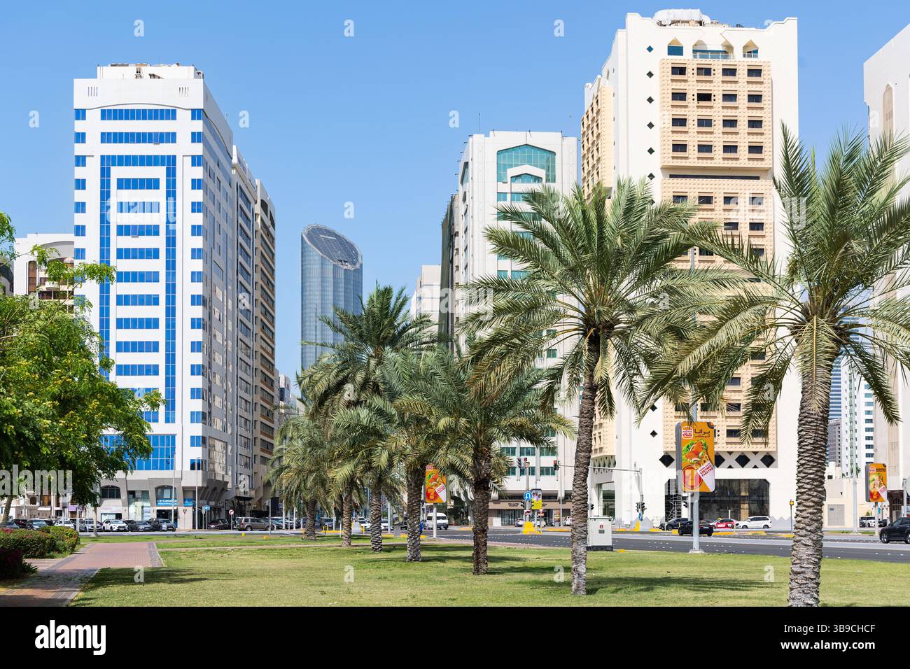 Abu Dhabi city at day time with modern beautiful buildings and skyscrapers. Street view of downtown Abu Dhabi UAE. City traffic. Travel photo, editori Stock Photo