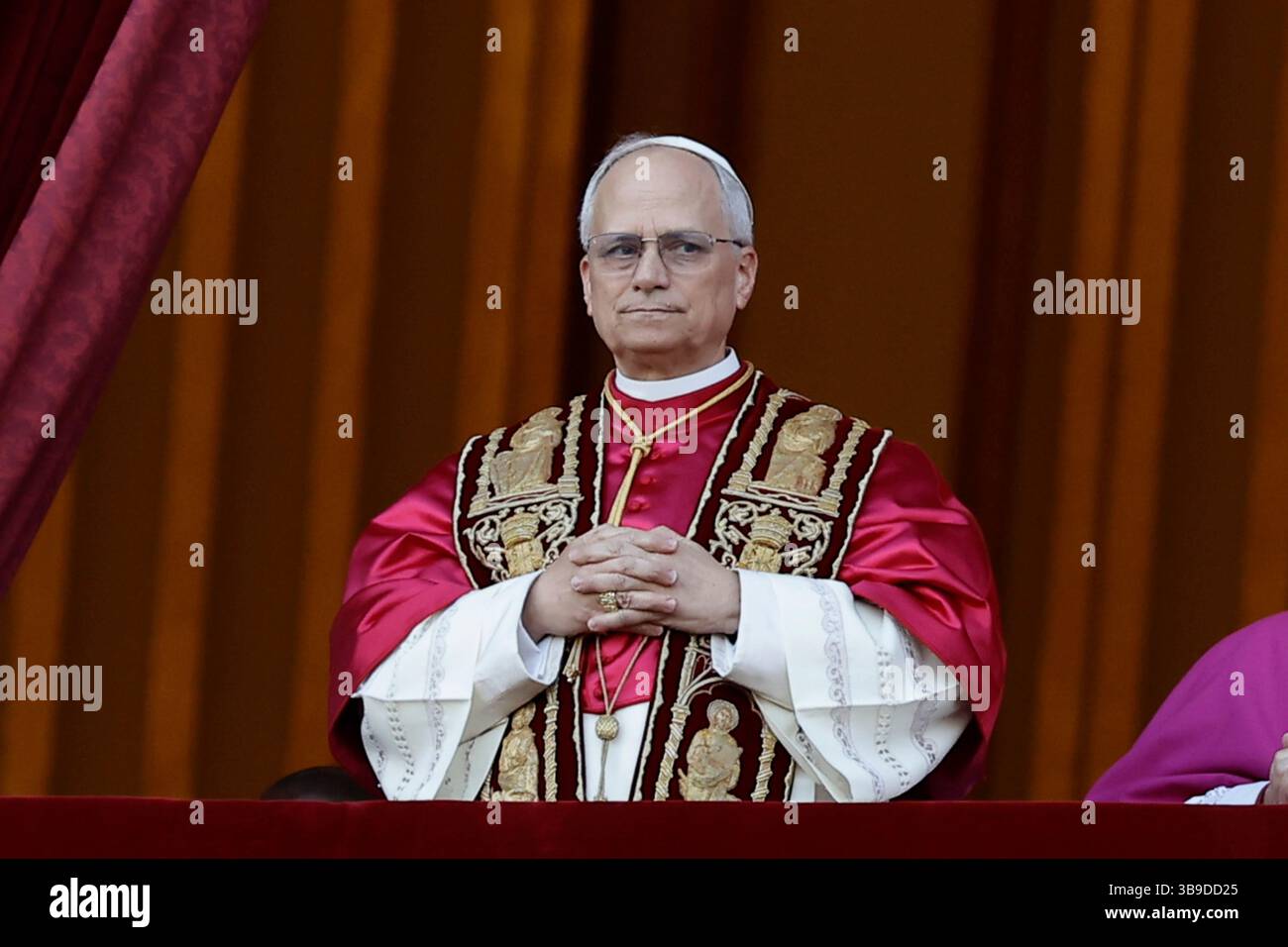 Vatican City, Vatican - Cardinal Robert Francis Prevost, the newly elected Pope Leone XIV, greets pilgrims and benefactors as he stands on the balcony of St Peter's Basilica after his election in Vatican City, Vatican, May 8, 2025. He became the 267th Pope after 4 number of rounds of voting by 112 cardinal electors. Stock Photo