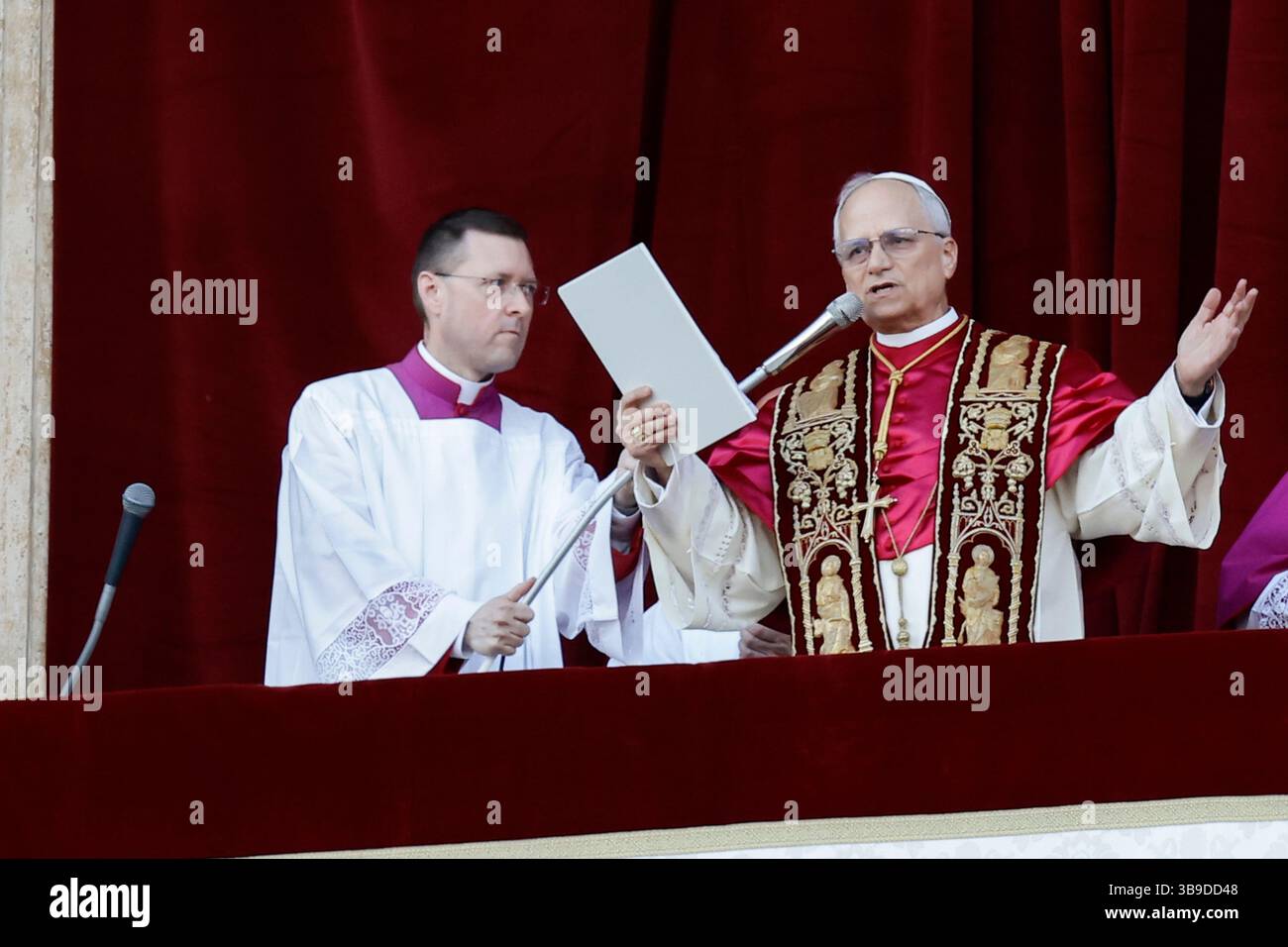 Vatican City, Vatican - Cardinal Robert Francis Prevost, the newly elected Pope Leone XIV, greets pilgrims and benefactors as he stands on the balcony of St Peter's Basilica after his election in Vatican City, Vatican, May 8, 2025. He became the 267th Pope after 4 number of rounds of voting by 112 cardinal electors. Stock Photo
