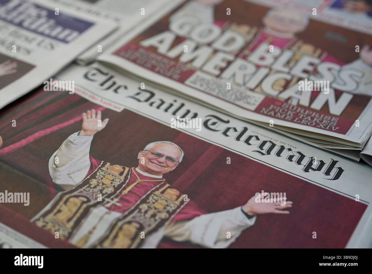 Newspapers with the front page of Newly elected Pope Leo XIV, are seen ...