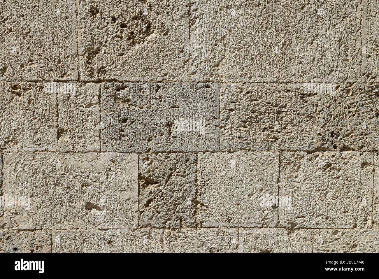 Antique ancient stone wall masonry texture background. Stock Photo