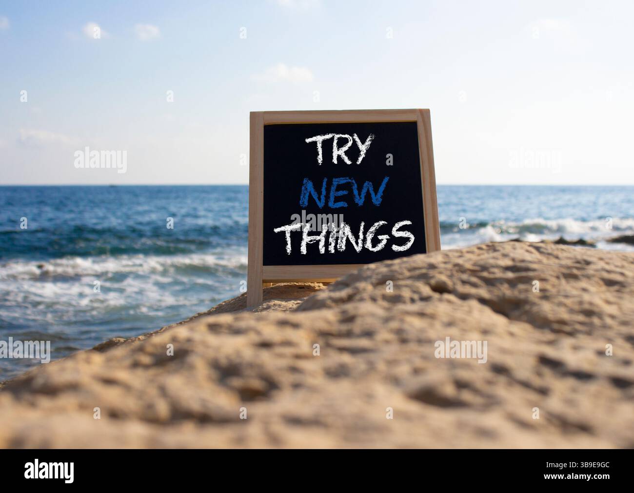 Try New Things Example Try new Things symbol. Concept words Try new Things on black chalk ...