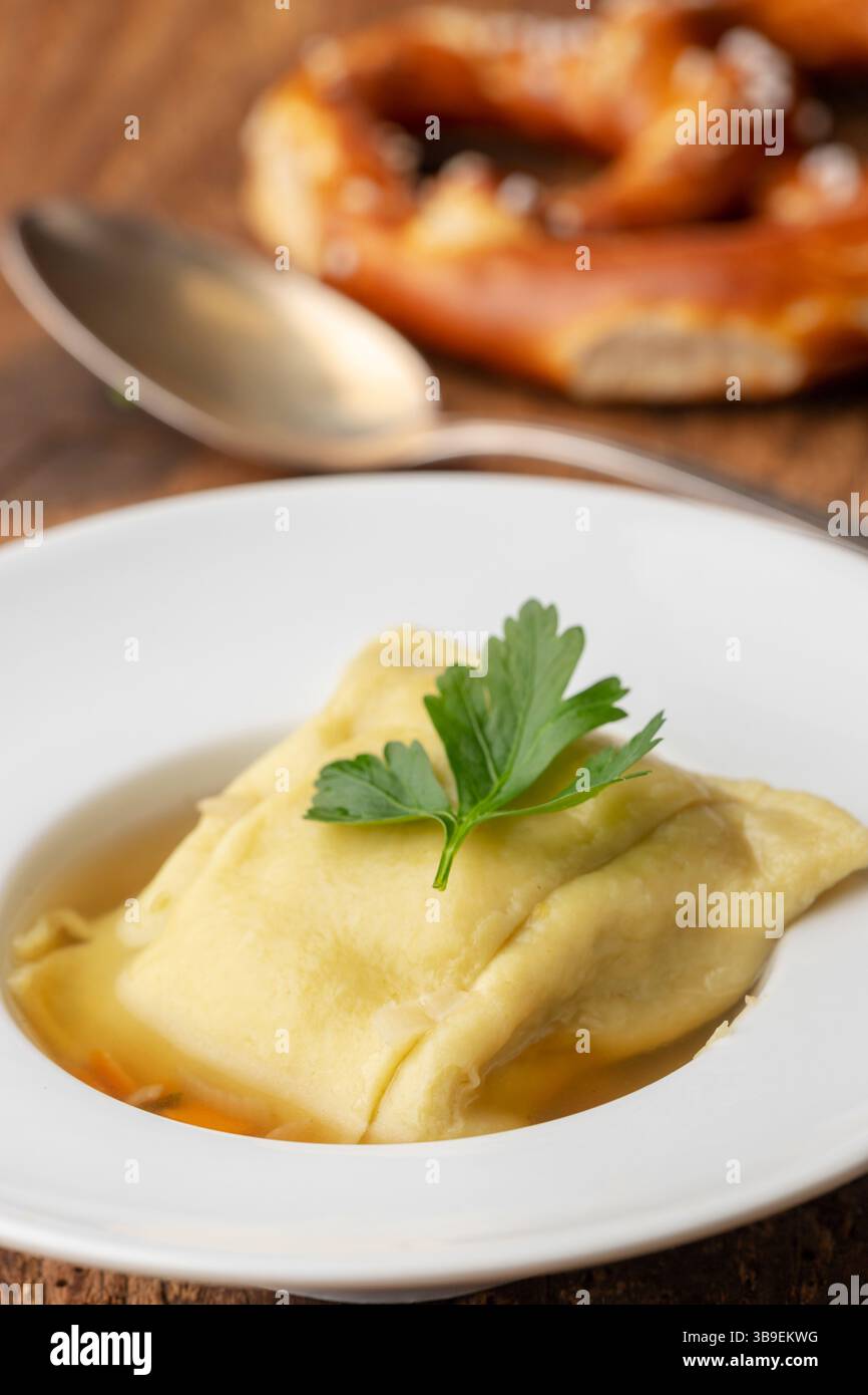 Swabian Maultasche in broth Stock Photo