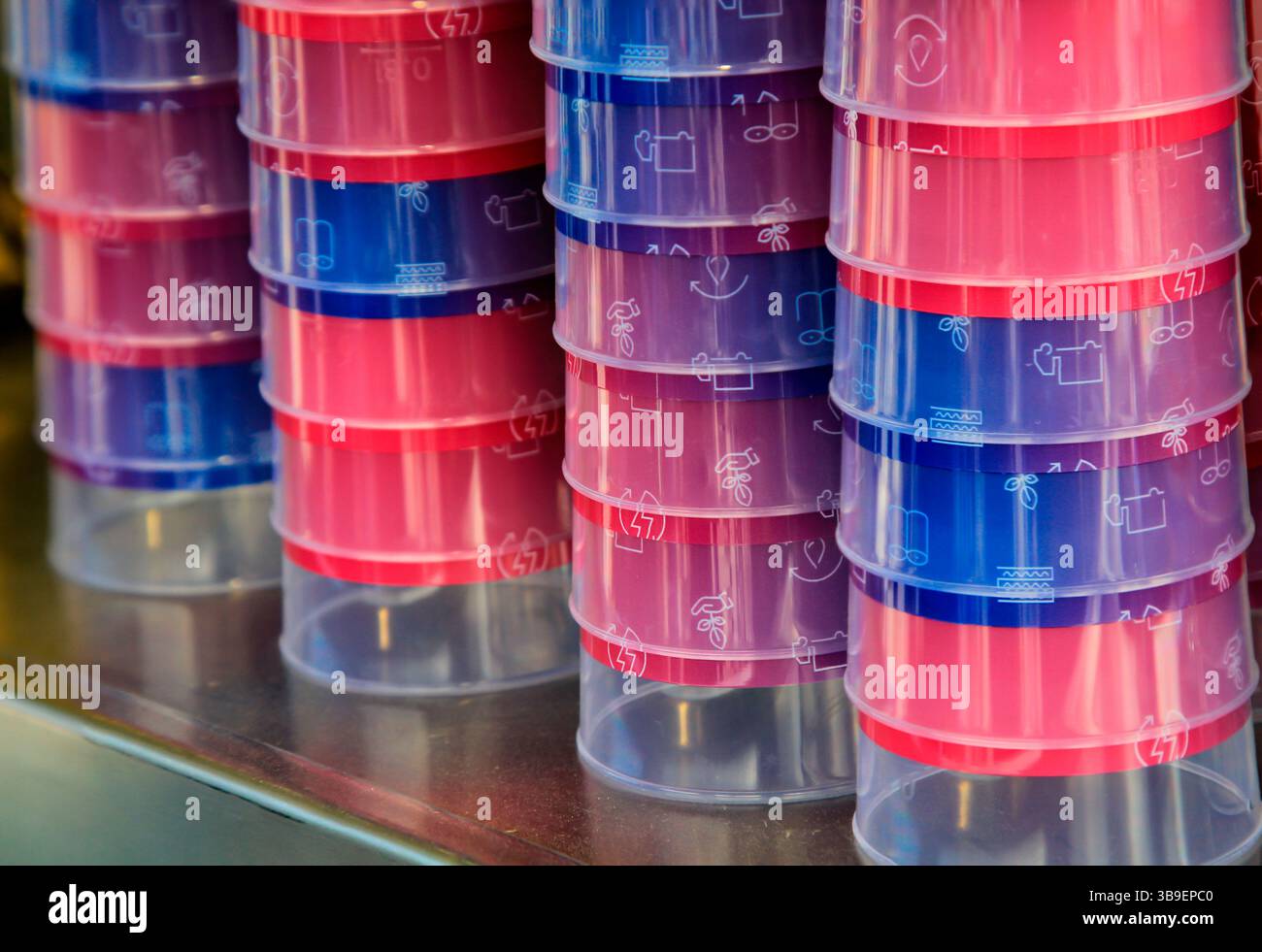Many stacked colourful plastic drinking cups Stock Photo