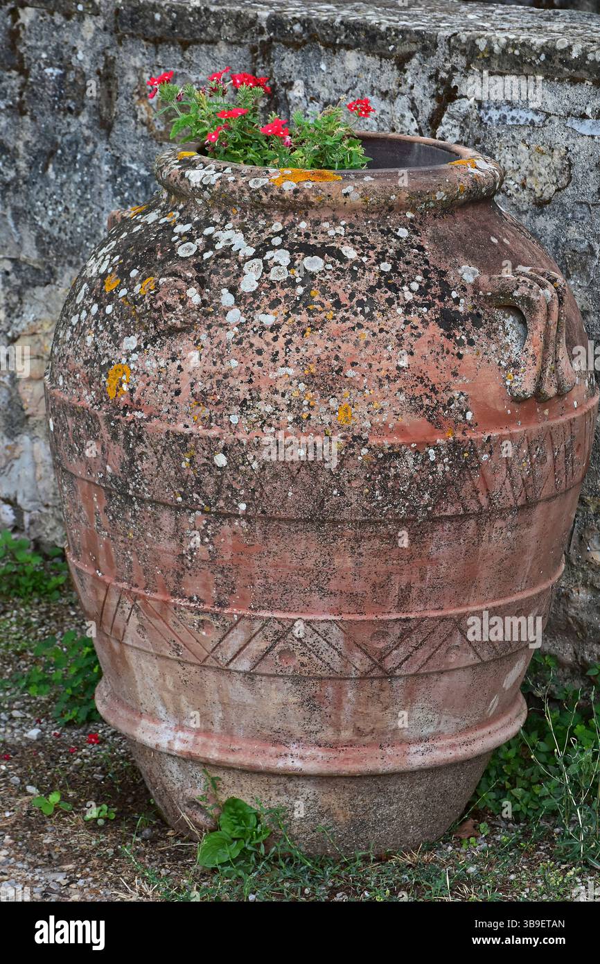 Old amphora as garden ornament Stock Photo