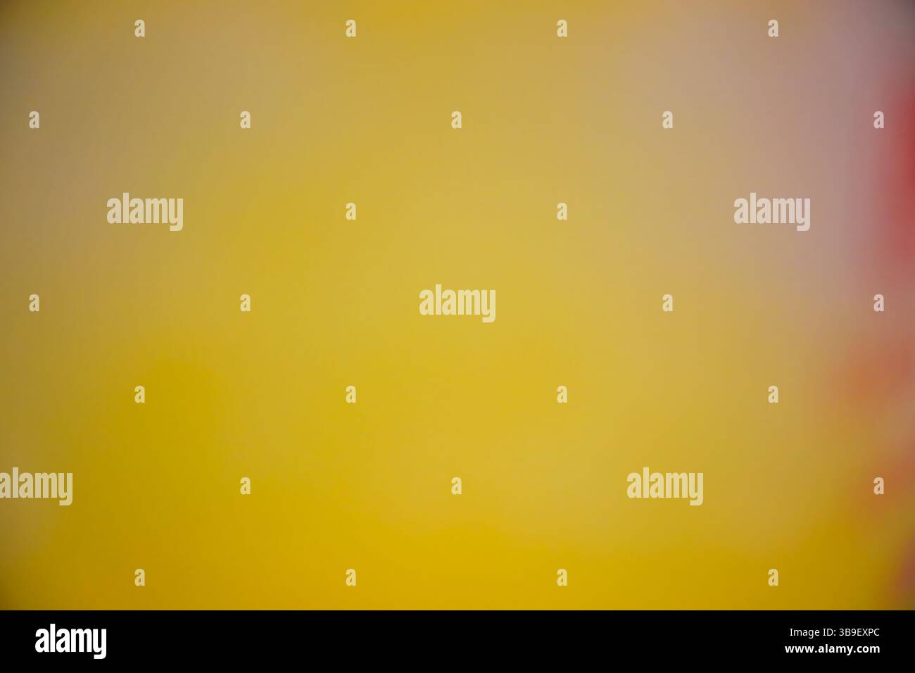 Blurred gradient of yellow and orange creating a soft background Stock Photo