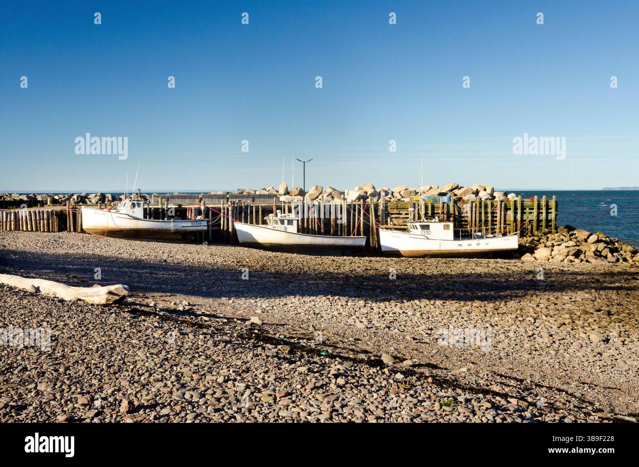 Fishing boats in Margaretsville harbour Stock Photo - Alamy