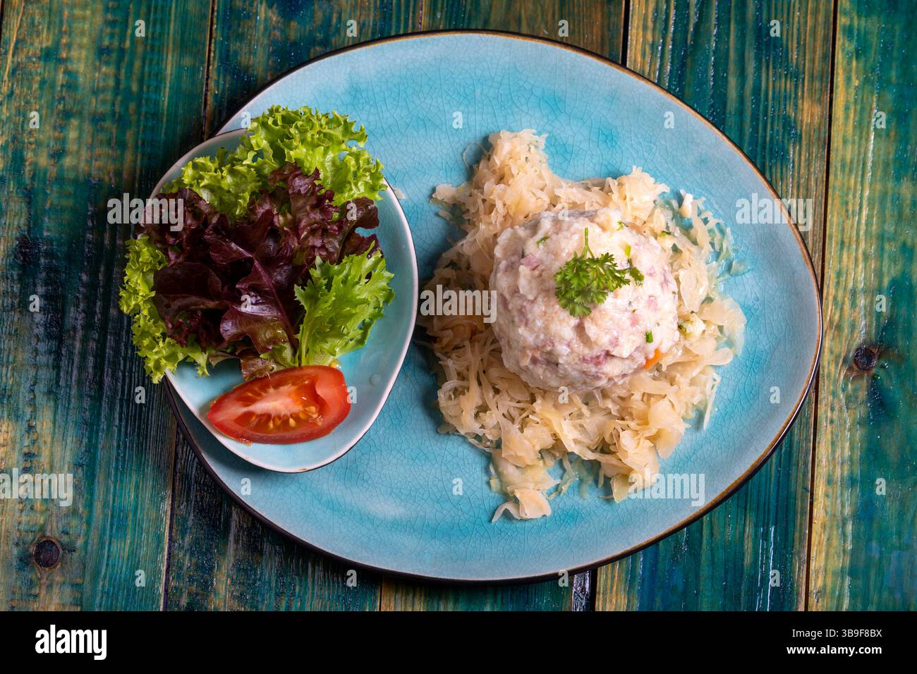 Bacon dumplings on sauerkraut Stock Photo