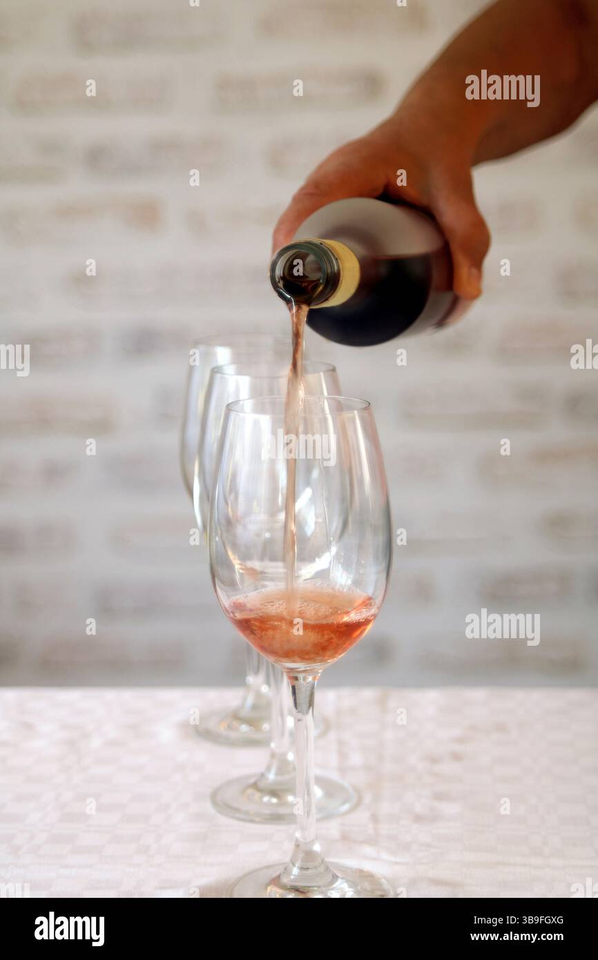 Wine tasting with rose wine Stock Photo - Alamy