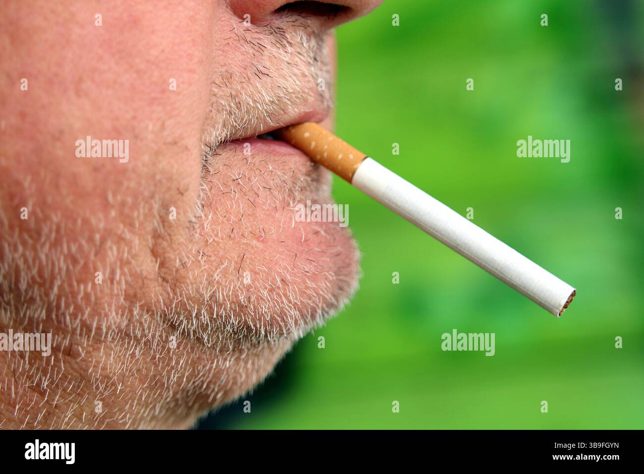 Cigarette in mouth hi-res stock photography and images