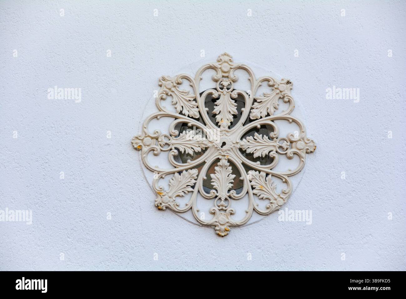 Decorative ornament on white house wall Stock Photo
