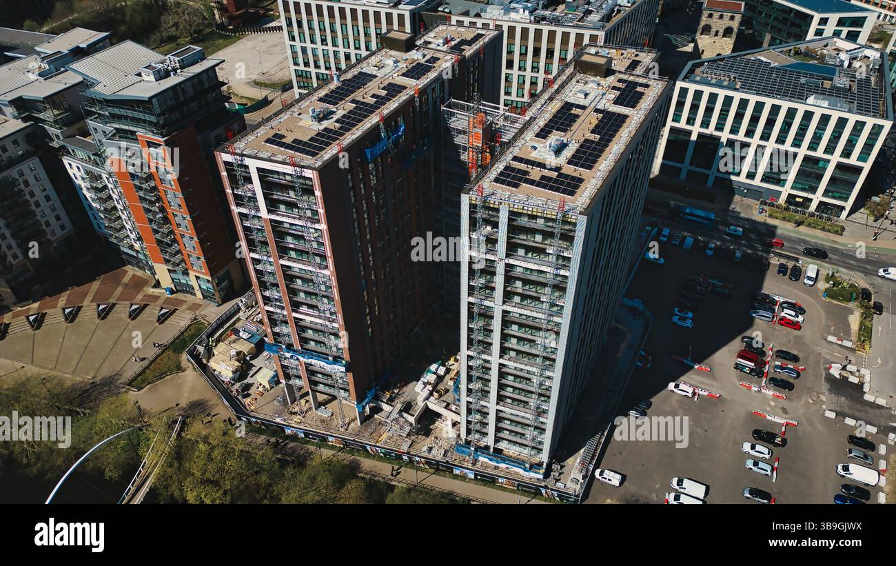 Aerial view shows high-rise buildings, some under construction, with ...